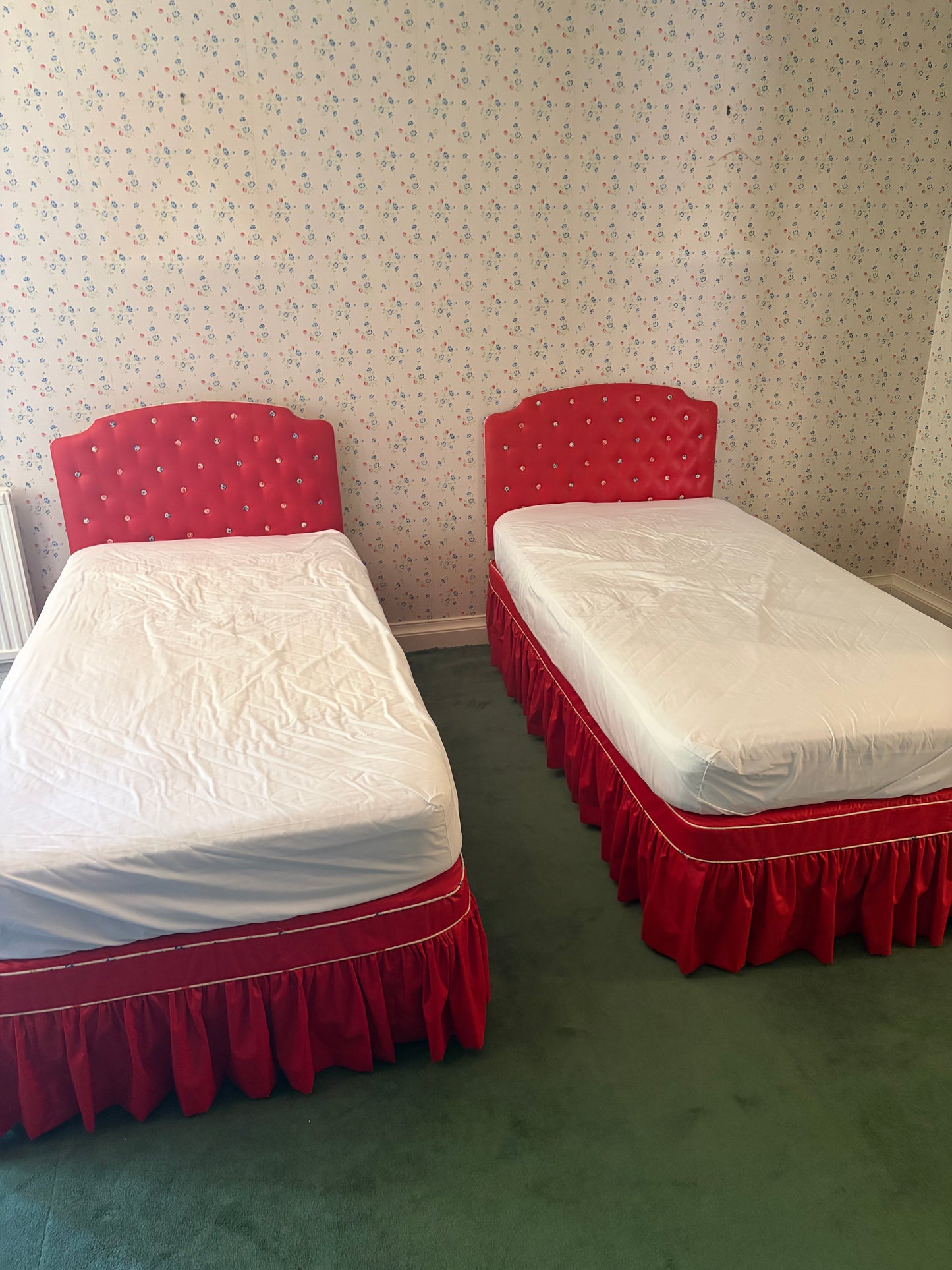 A PAIR OF SINGLE BEDS