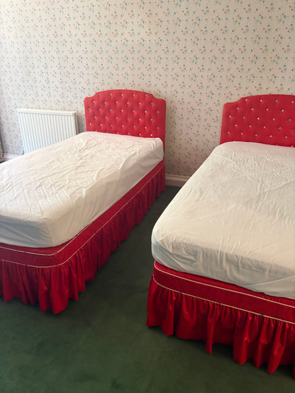 A PAIR OF SINGLE BEDS